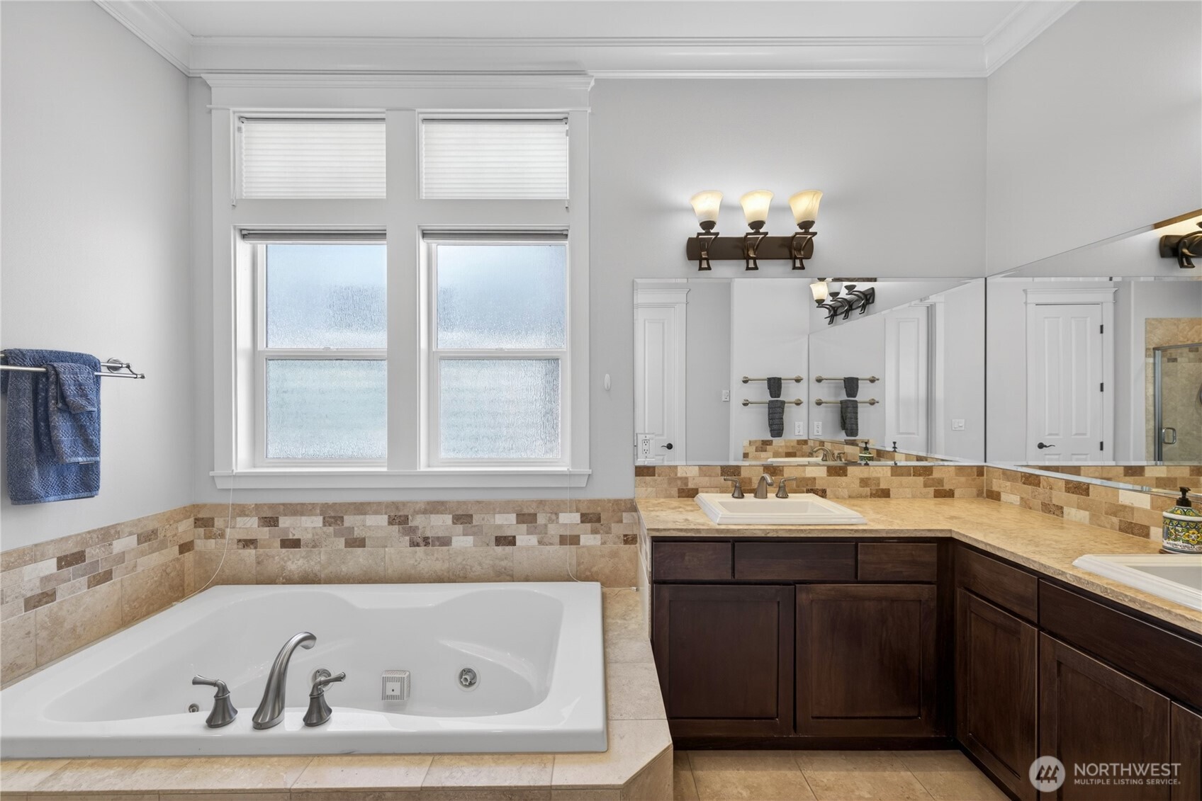 1908 29th Place Anacortes, WA 98221 - Photo 35 of 40 a bathroom with a tub sink and mirror