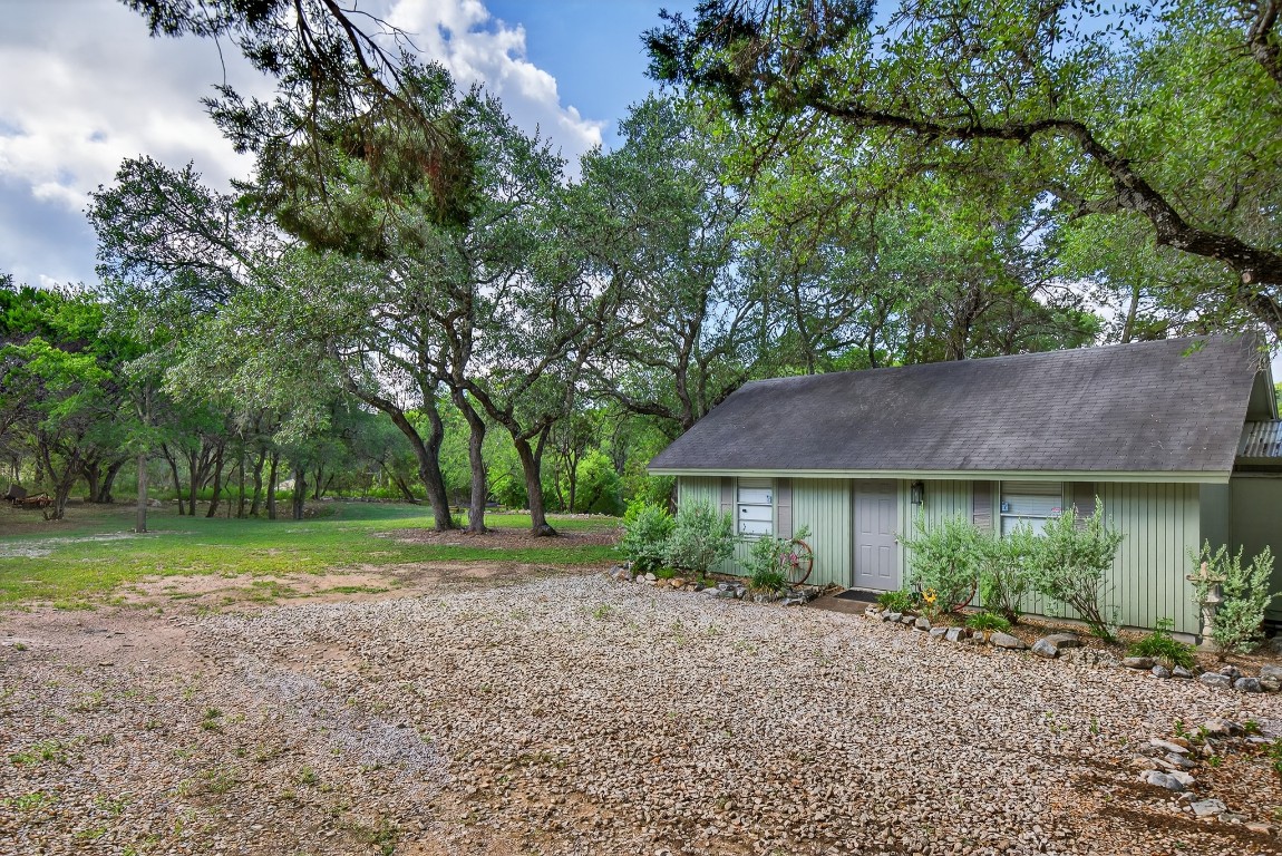 23642-23644 Nameless Road Leander, TX 78641 - Photo 16 of 37 a view of a house with a yard and a large tree