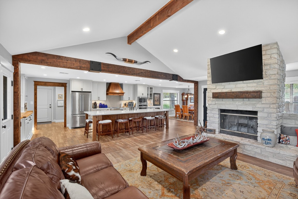 23642-23644 Nameless Road Leander, TX 78641 - Photo 23 of 37 a living room with furniture a flat screen tv and a fireplace