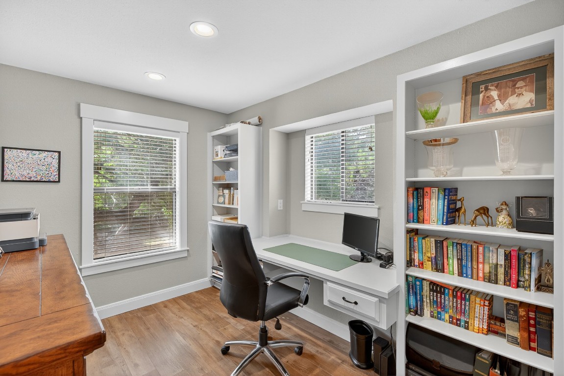 23642-23644 Nameless Road Leander, TX 78641 - Photo 31 of 37 a view of a workspace with bookshelf and a window
