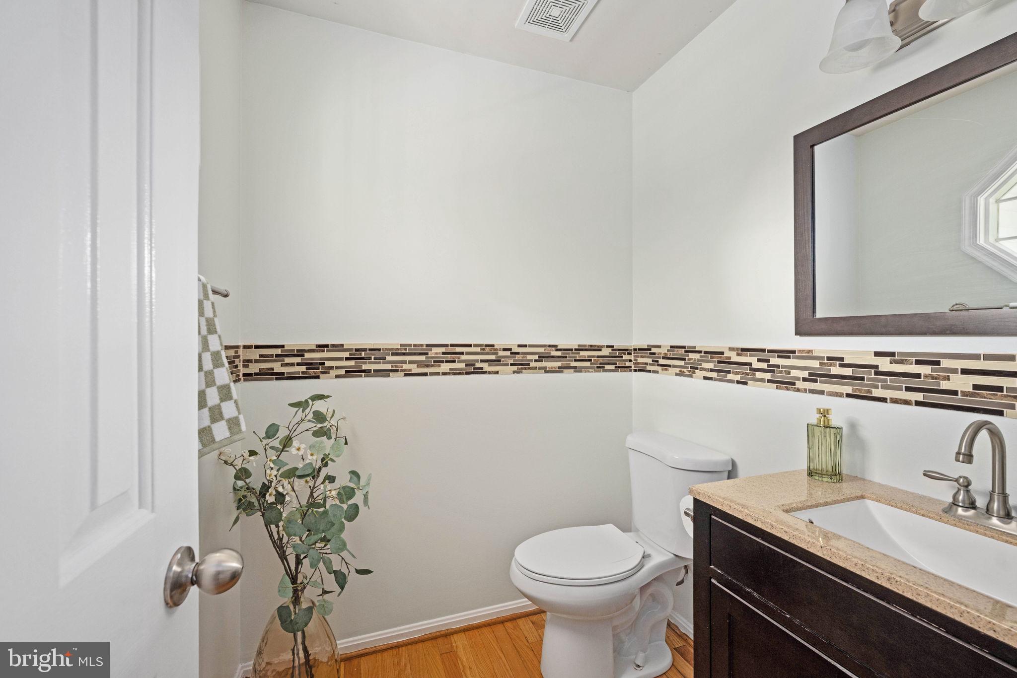 246 Choptank Road Stafford, VA 22556 - Photo 11 of 98 a bathroom with a granite countertop sink and a mirror