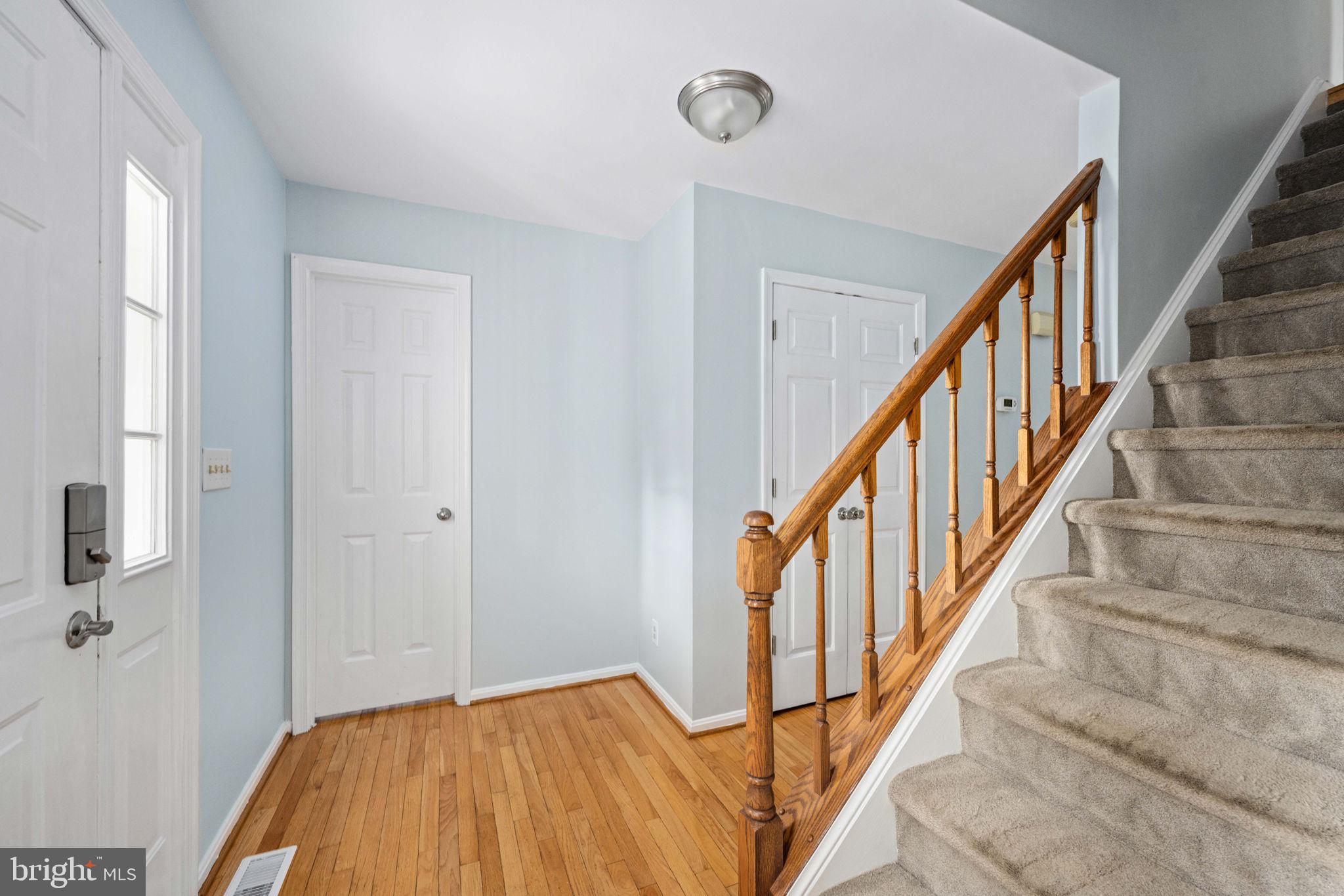 246 Choptank Road Stafford, VA 22556 - Photo 14 of 98 a view of a hallway with wooden floor and staircase