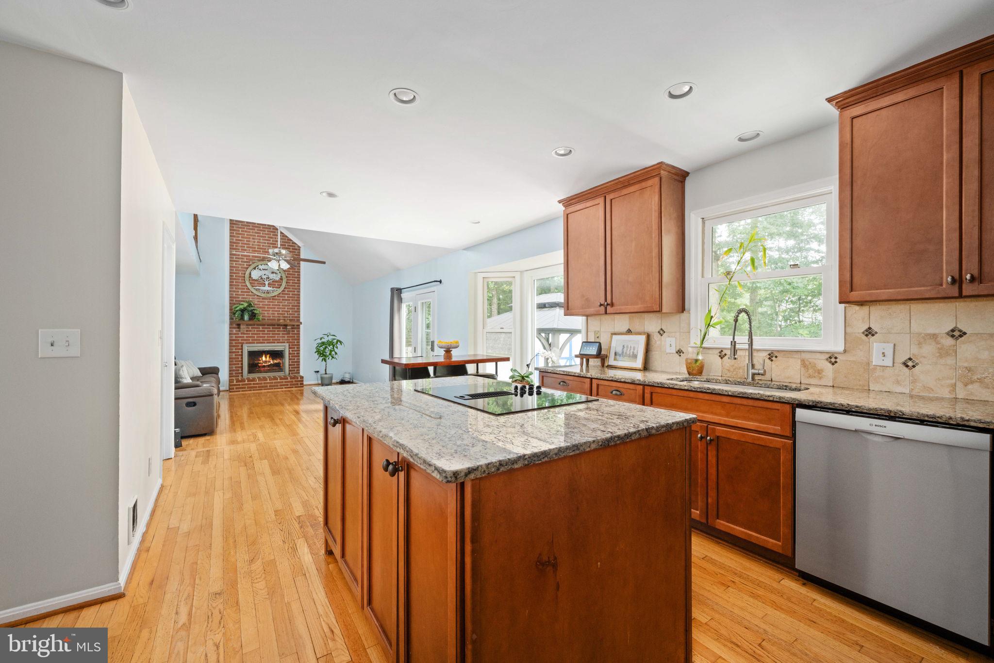 246 Choptank Road Stafford, VA 22556 - Photo 23 of 98 a kitchen with stainless steel appliances granite countertop wooden cabinets a sink and dishwasher a refrigerator with wooden floor