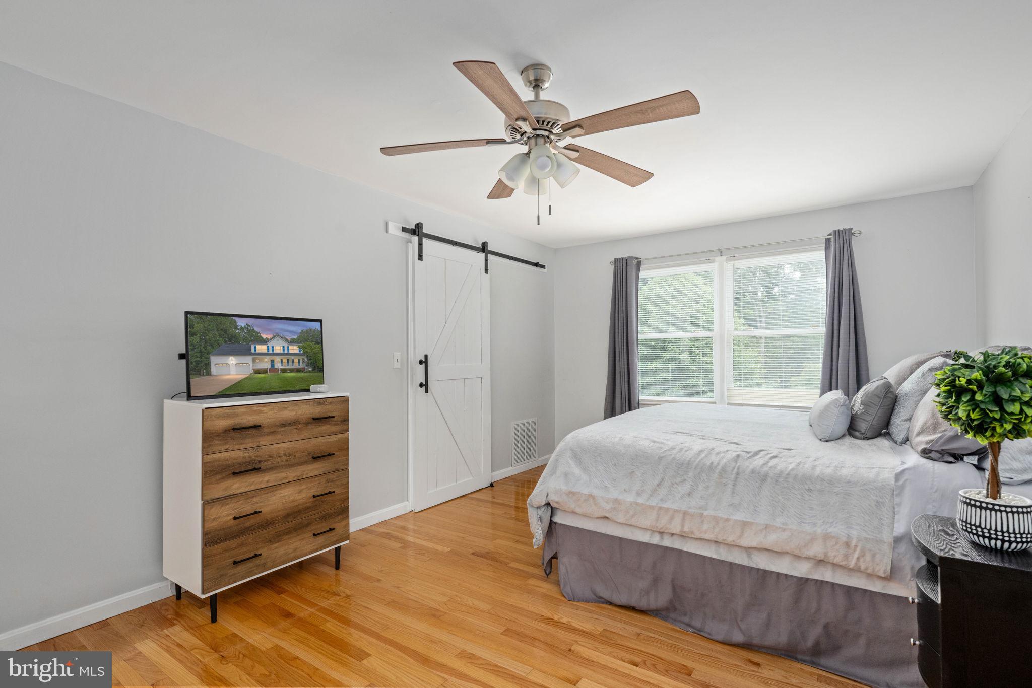 246 Choptank Road Stafford, VA 22556 - Photo 49 of 98 a bedroom with a bed and a window