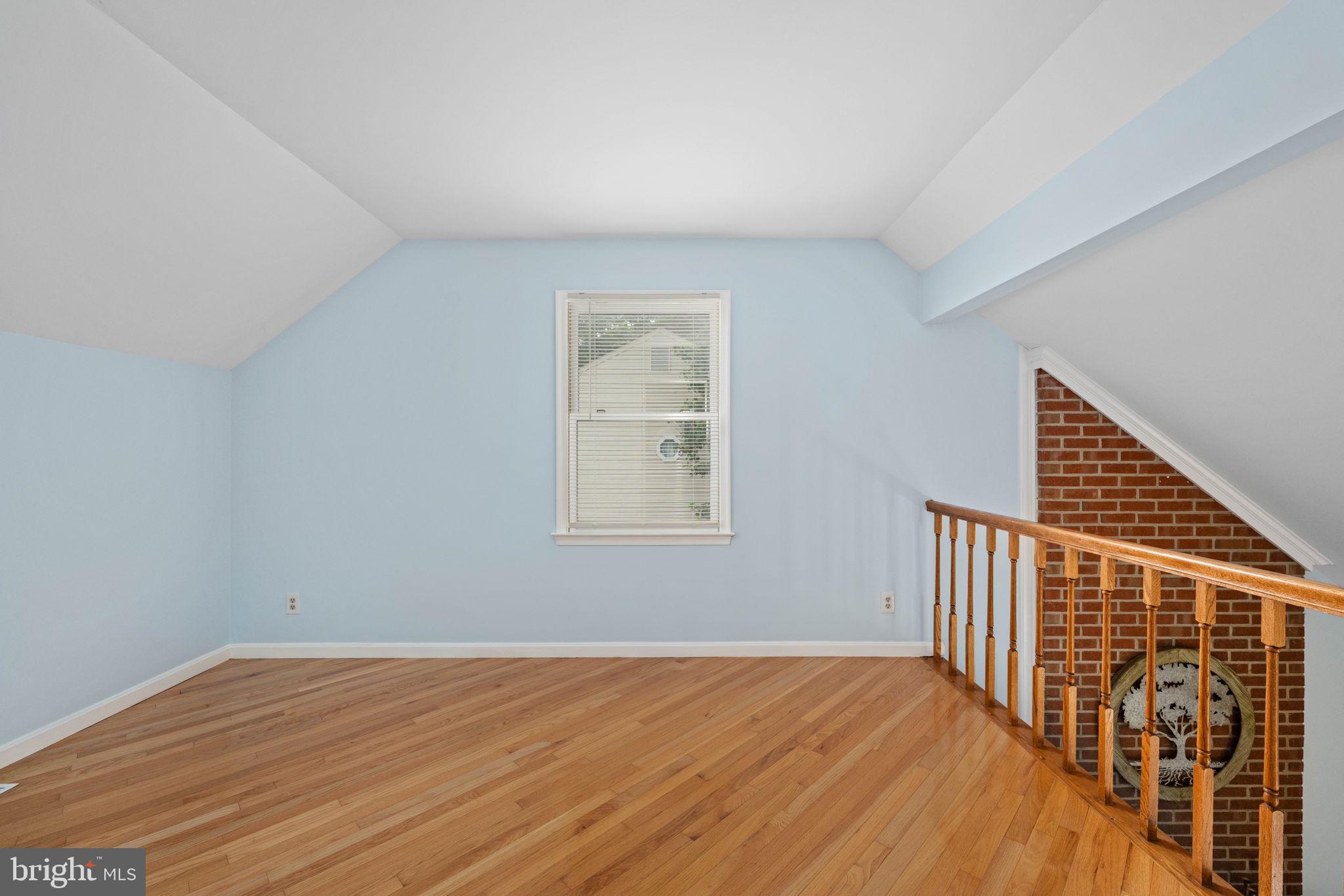 246 Choptank Road Stafford, VA 22556 - Photo 56 of 98 a view of an empty room with wooden floor and a window