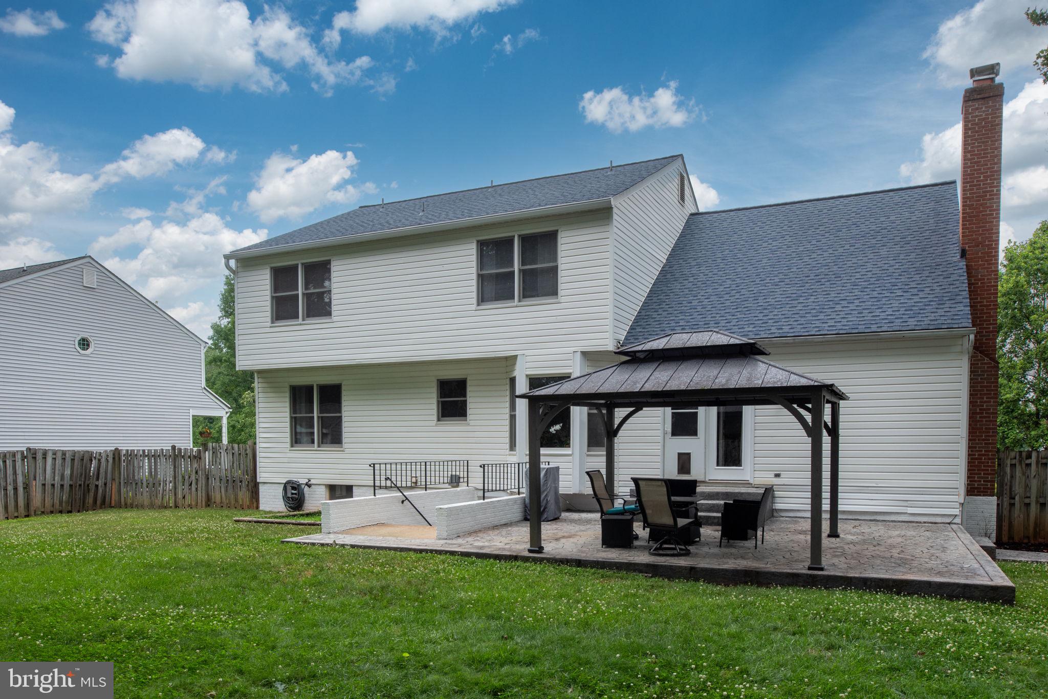 246 Choptank Road Stafford, VA 22556 - Photo 79 of 98 a front view of a house with patio and garden