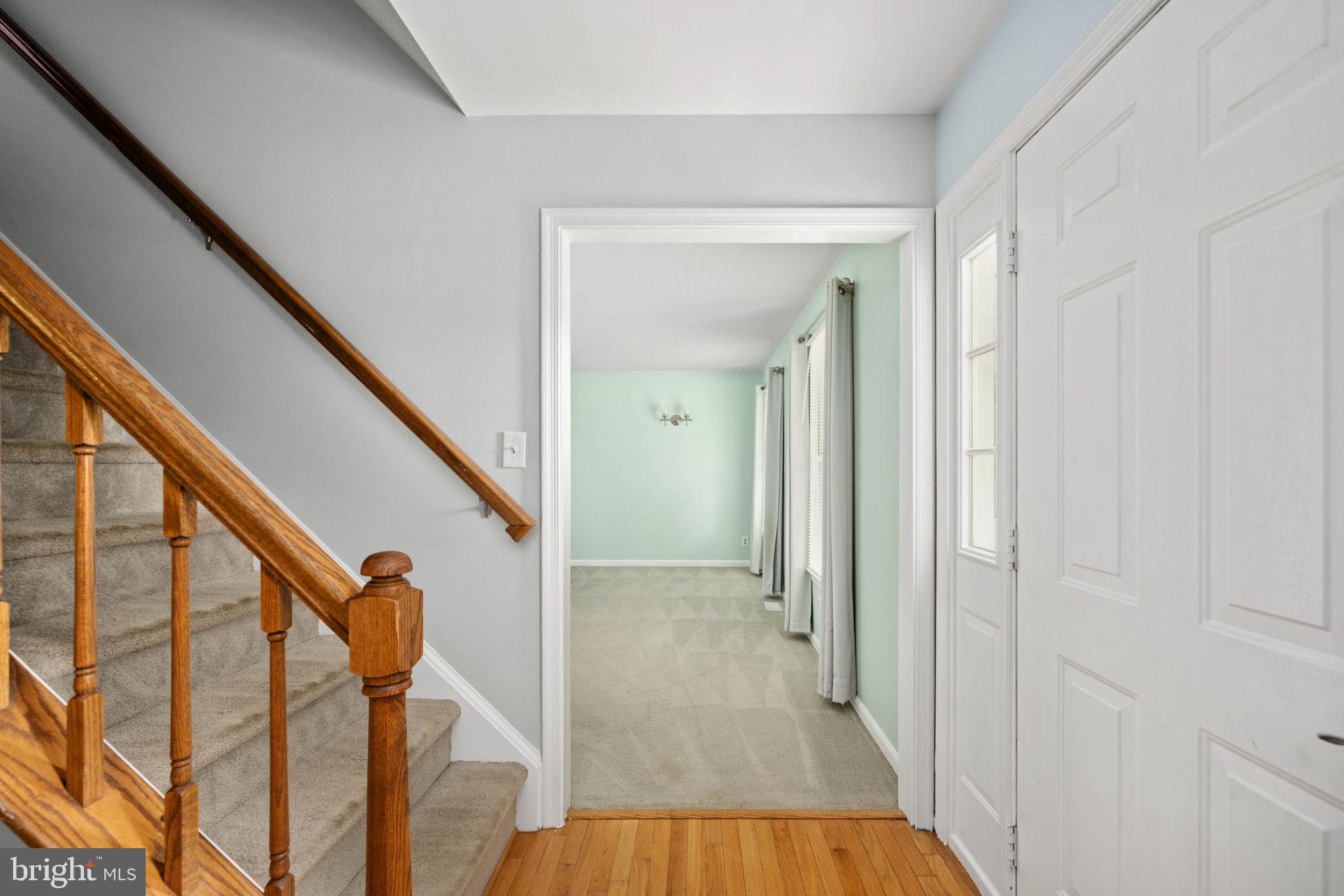 246 Choptank Road Stafford, VA 22556 - Photo 8 of 98 a view of a hallway with wooden floor and staircase