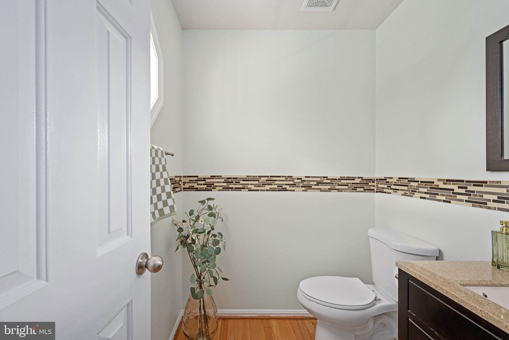 246 Choptank Road Stafford, VA 22556 - Photo 10 of 98 a bathroom with a granite countertop toilet and a sink