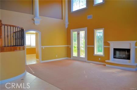 2394 Old Heritage Road Riverside, CA 92503 - Photo 21 of 45 a view of an empty room with a fireplace and a window