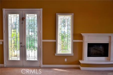 2394 Old Heritage Road Riverside, CA 92503 - Photo 22 of 45 a view of an empty room with a fireplace and window