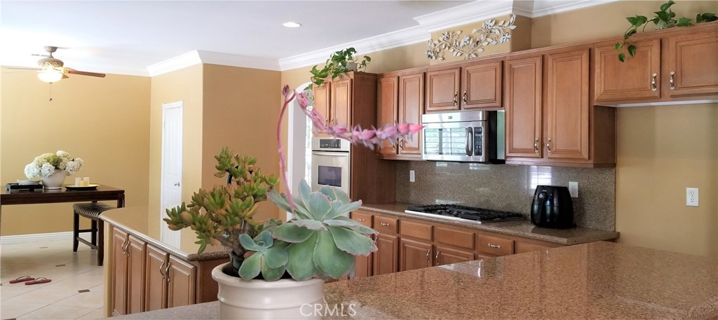 2394 Old Heritage Road Riverside, CA 92503 - Photo 24 of 45 a kitchen with a table and chairs