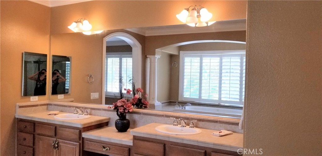 2394 Old Heritage Road Riverside, CA 92503 - Photo 25 of 45 a bathroom with a sink and a mirror