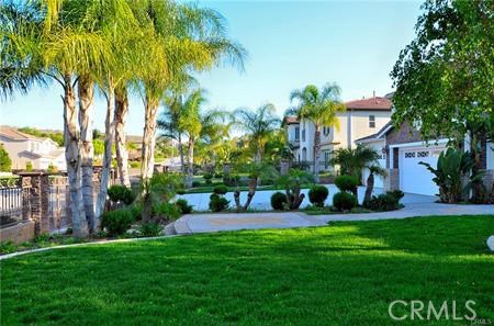 2394 Old Heritage Road Riverside, CA 92503 - Photo 4 of 45 a view of a house with a yard and palm trees