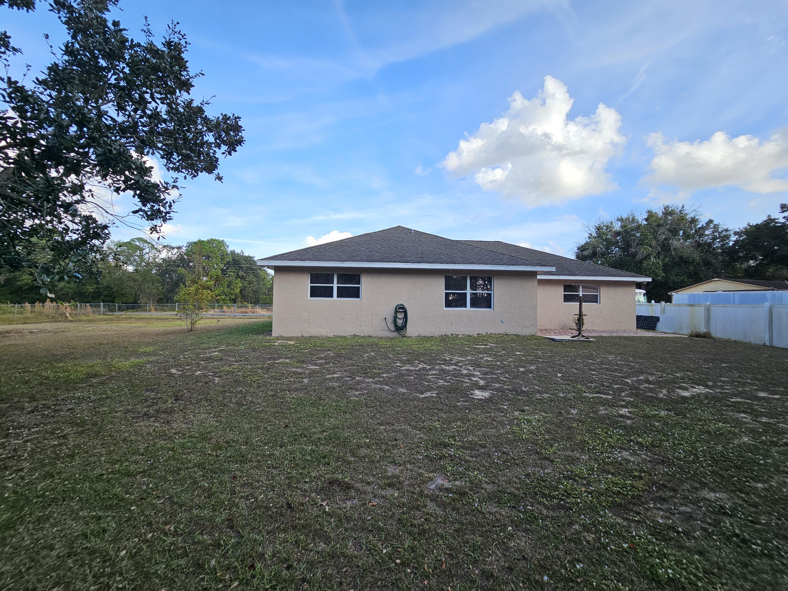 1514 Summer Road Lake Placid, FL 33852 - Photo 46 of 52 a view of house with a big yard