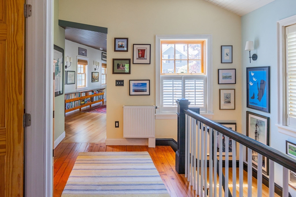 27 Maverick Street Marblehead, MA 01945 - Photo 8 of 31 a view of a hallway with wooden floor and stairs