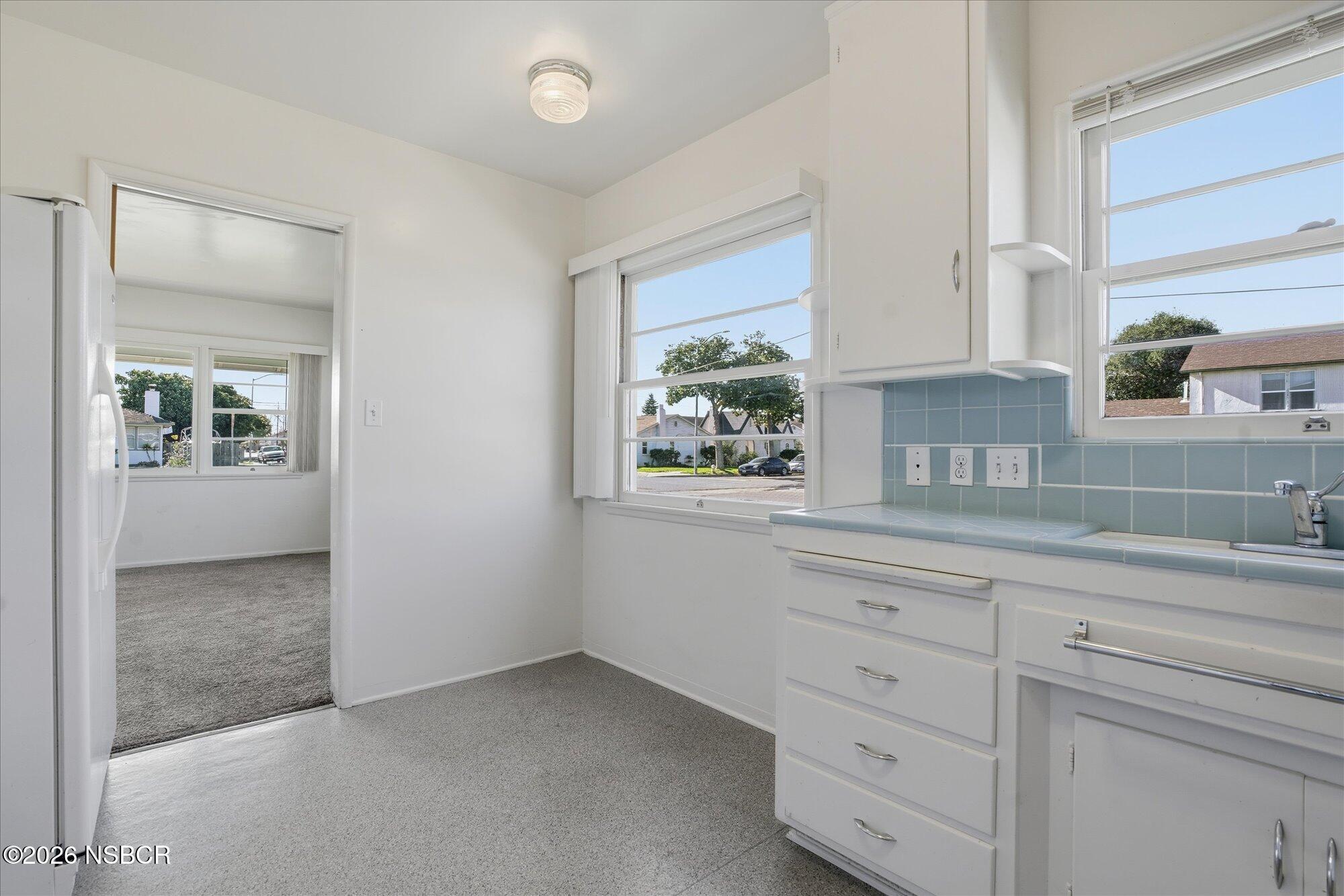 801 East Cook Street Santa Maria, CA 93454 - Photo 6 of 18 an empty room with cabinet and window
