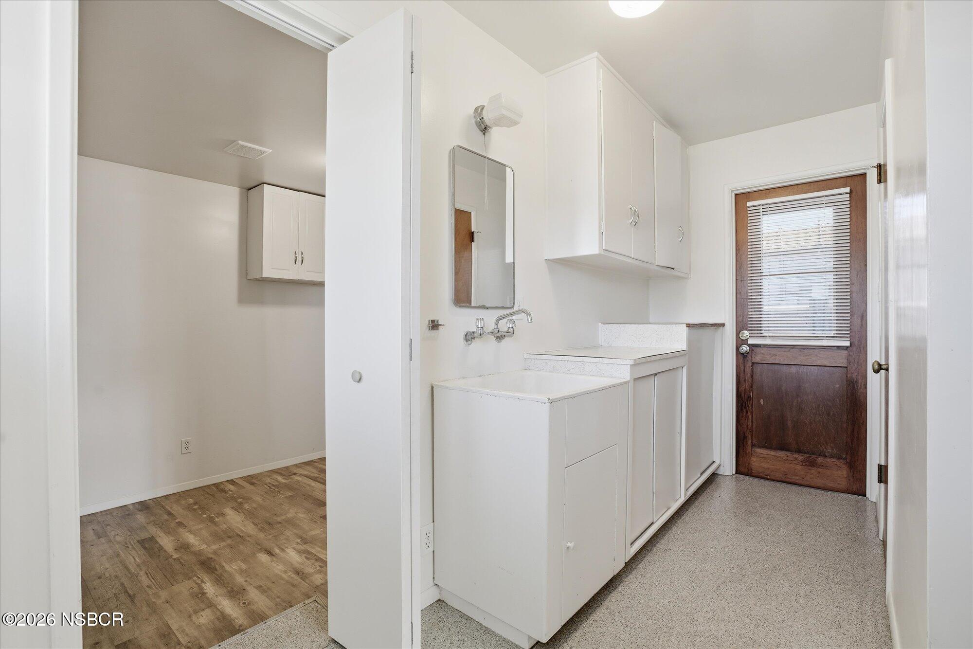 801 East Cook Street Santa Maria, CA 93454 - Photo 8 of 18 a bathroom with a sink a mirror and shower