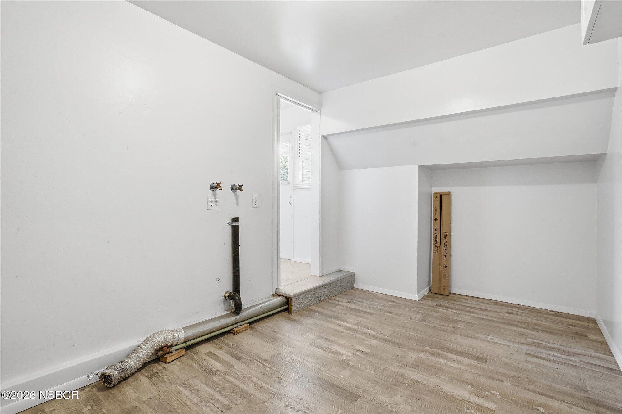 801 East Cook Street Santa Maria, CA 93454 - Photo 9 of 18 an empty room with wooden floor and closet