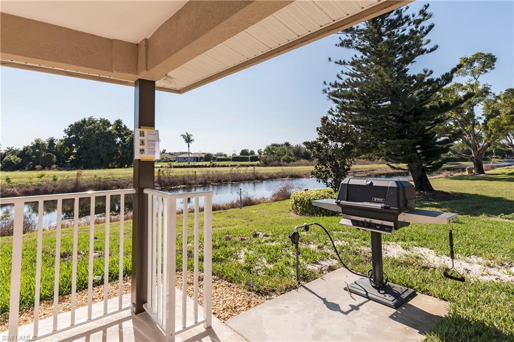 5451 Rattlesnake Hammock Road, Unit D108 Naples, FL 34113 - Photo 17 of 17 a view of a lake with a mountain in the background