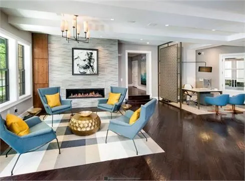 a living room with fireplace furniture and a chandelier