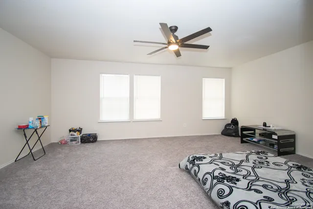 a bed room with a bed and a chandelier