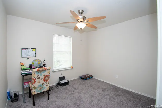 a bathroom with a sink mirror vanity and toilet
