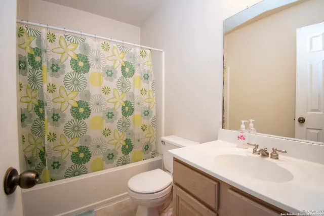 a view of a porch with furniture and a yard