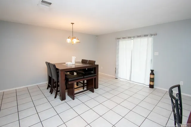 a room that has a table and a chair in it