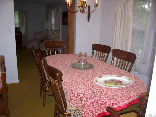 2109 East Charlotte Court Raleigh, NC 27607 - Photo 4 of 9 a view of a dining room with furniture