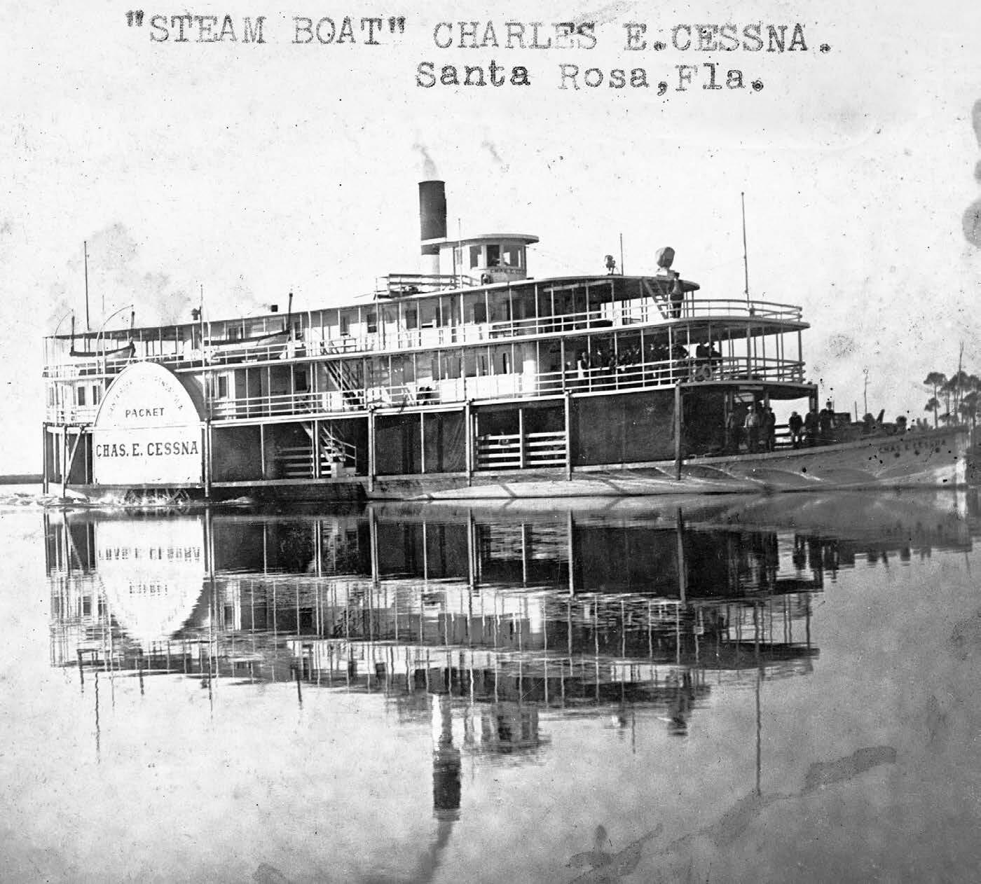 Lot 90 West Perseverance Point Freeport, FL 32439 - Photo 18 of 32 a front view of a building with glass top table and chairs