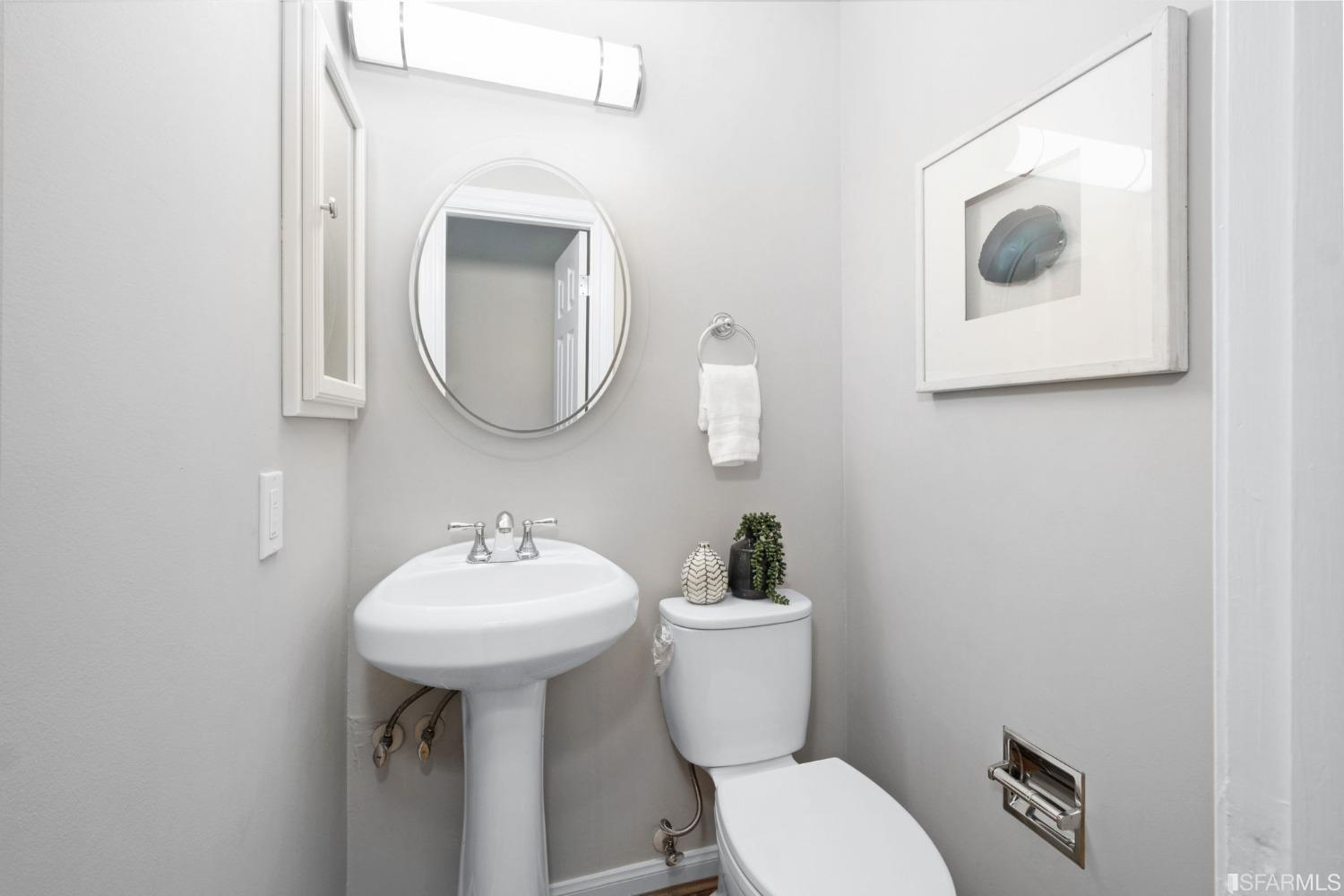 413 Woodminster Drive Moraga, CA 94556 - Photo 11 of 33 a bathroom with a toilet sink and mirror