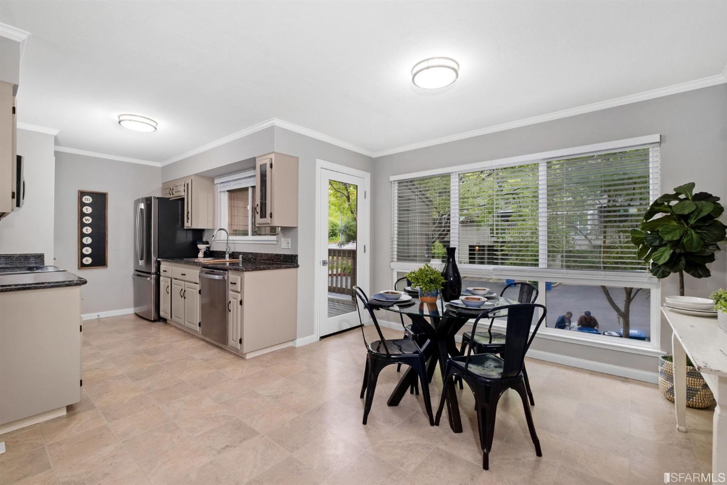 413 Woodminster Drive Moraga, CA 94556 - Photo 12 of 33 a view of a dining room with furniture and a large window