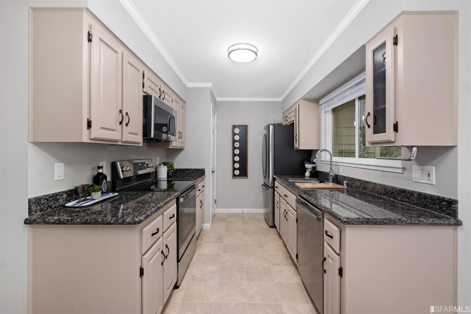 413 Woodminster Drive Moraga, CA 94556 - Photo 14 of 33 a kitchen with granite countertop a sink a stove and cabinets