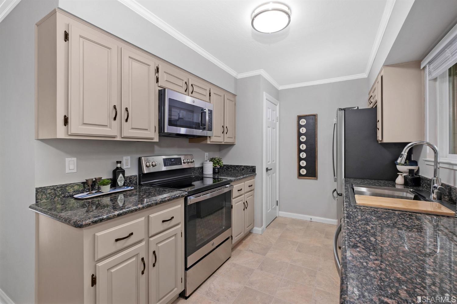 413 Woodminster Drive Moraga, CA 94556 - Photo 15 of 33 a kitchen with stainless steel appliances granite countertop a stove a sink and a microwave