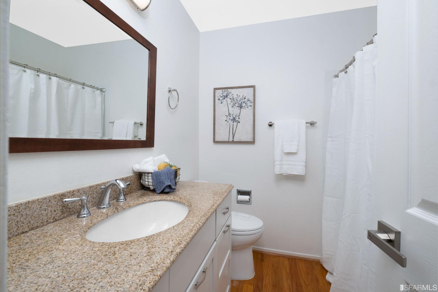 413 Woodminster Drive Moraga, CA 94556 - Photo 20 of 33 a bathroom with a granite countertop sink mirror vanity and toilet