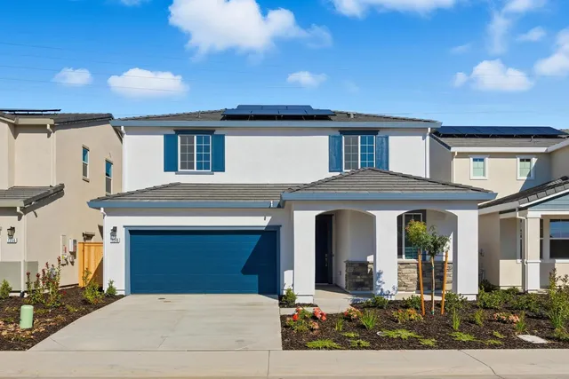 a front view of a house with yard