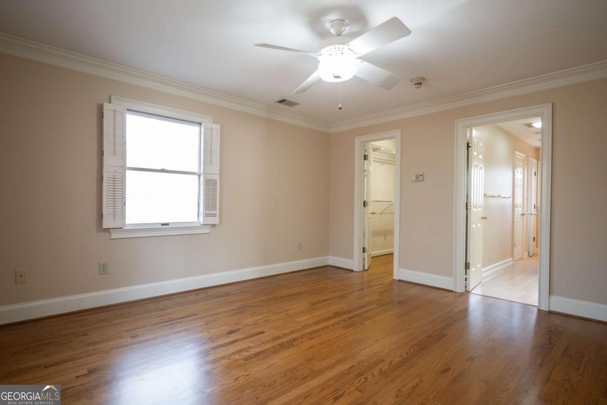 2191 Salem Road Watkinsville, GA 30677 - Photo 31 of 79 a view of an empty room with wooden floor and a window