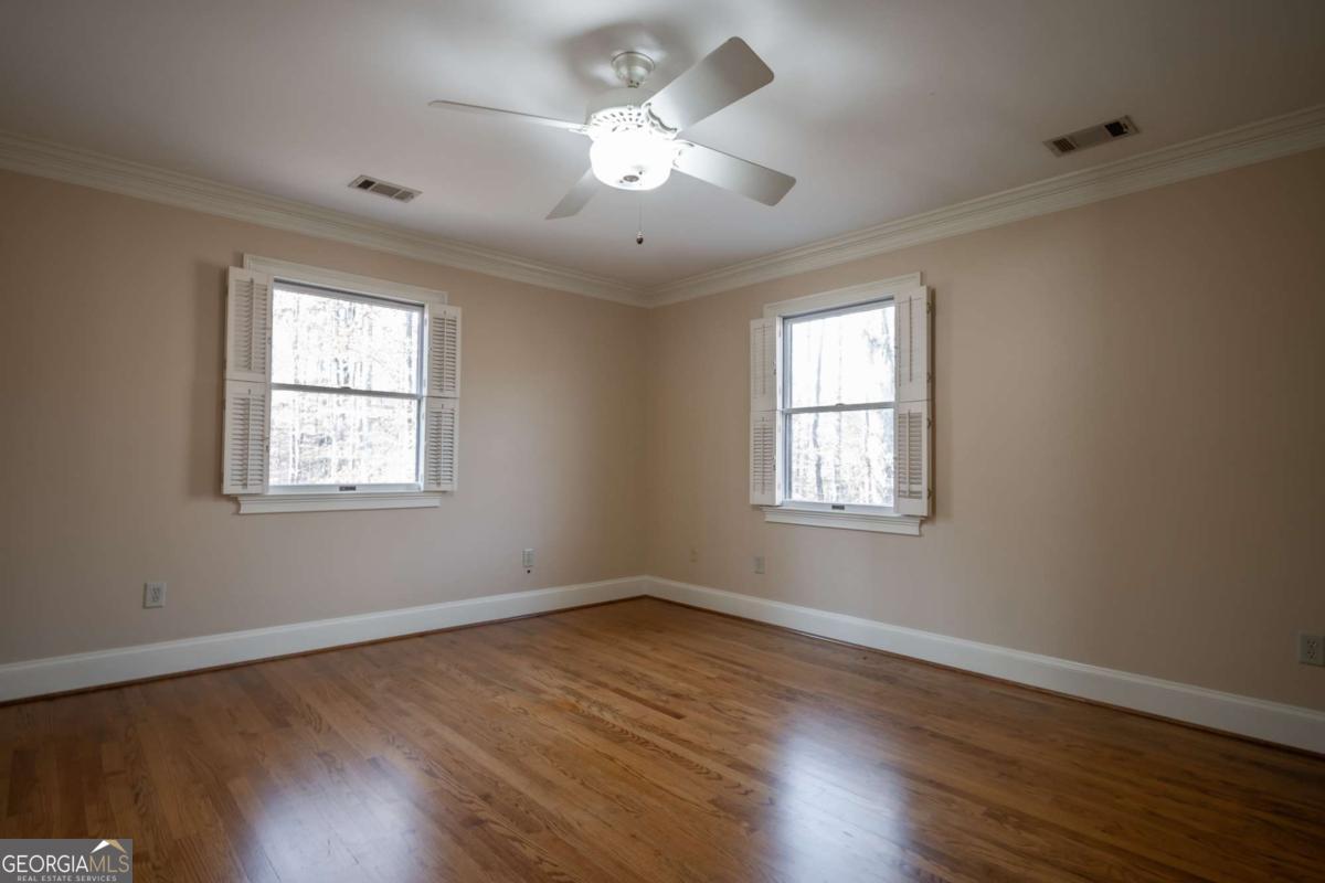 2191 Salem Road Watkinsville, GA 30677 - Photo 33 of 79 a view of an empty room with wooden floor and a window
