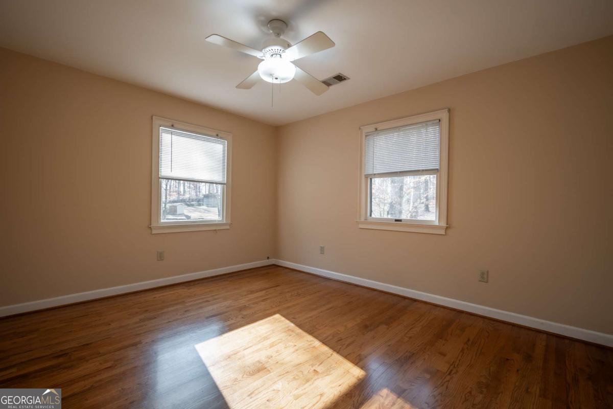 2191 Salem Road Watkinsville, GA 30677 - Photo 40 of 79 a view of an empty room with a window and wooden floor