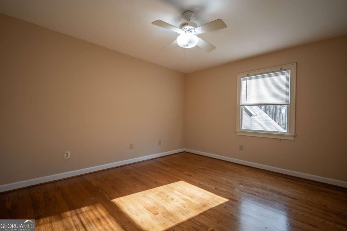 2191 Salem Road Watkinsville, GA 30677 - Photo 41 of 79 a view of a big room with wooden floor and windows
