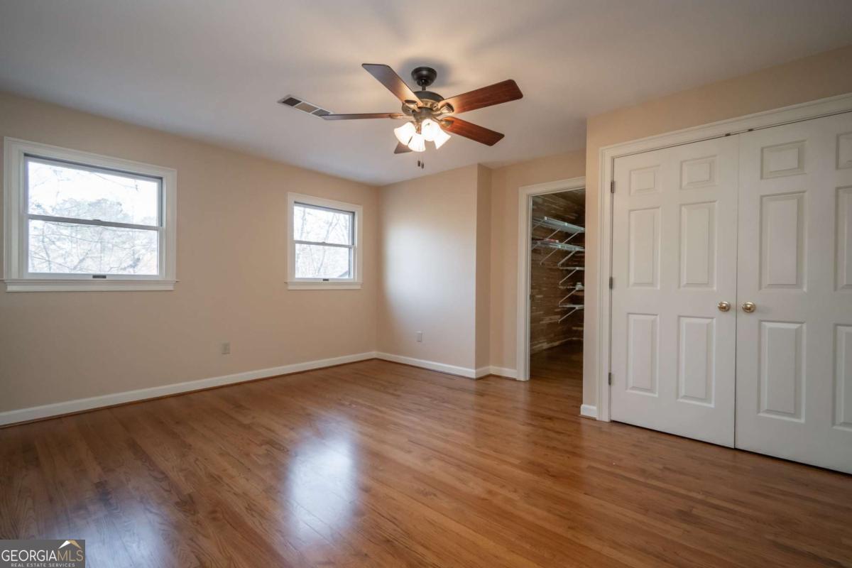 2191 Salem Road Watkinsville, GA 30677 - Photo 44 of 79 a view of an empty room with wooden floor and a window