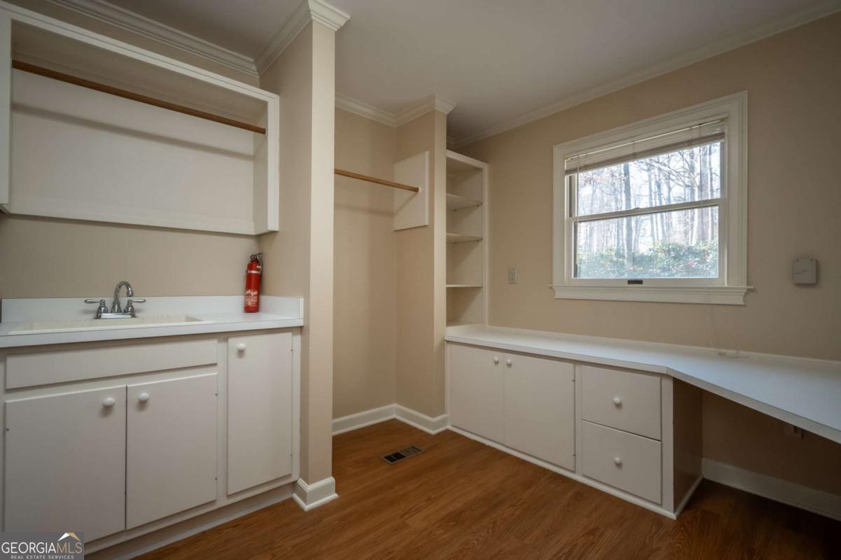 2191 Salem Road Watkinsville, GA 30677 - Photo 54 of 79 a room with a sink cabinets and a window