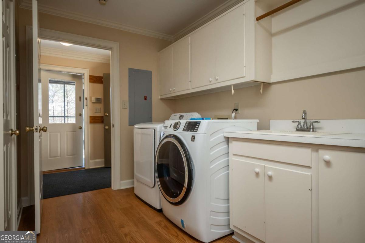 2191 Salem Road Watkinsville, GA 30677 - Photo 55 of 79 a utility room with sink dryer and washer