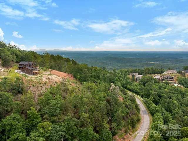 a view of kitchen with wooden floor and electronic appliances