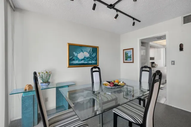 a kitchen with a refrigerator and a sink