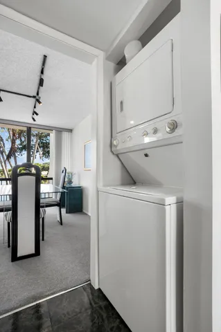 a kitchen with a stove a refrigerator and a sink