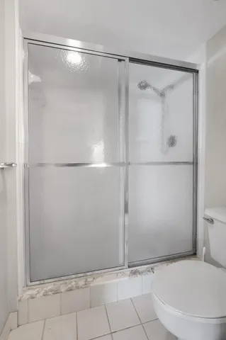 a living room with furniture and a lamp