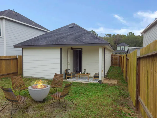 a view of a backyard with patio