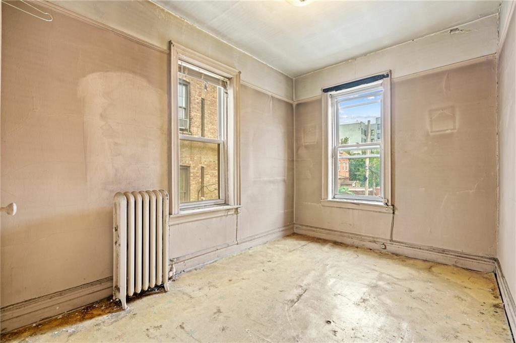 282 Buffalo Avenue Brooklyn, NY 11213 - Photo 15 of 22 an empty room with a window