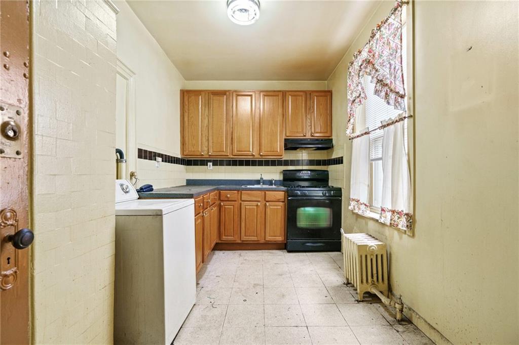 282 Buffalo Avenue Brooklyn, NY 11213 - Photo 16 of 22 a kitchen with a stove top oven sink and cabinets